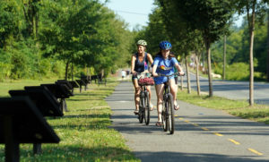 Bikers pass by the StoryWalk(R) project along the Rappahannock Heritage Trail. The project, which was started in Vermont, has been recreated in all 50 states and various countries across the globe. Photo by Suzanne Carr Rossi.