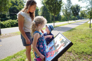 Piper and Pierce Gardner, along with mom Stephanie, read 'Alex's Day on the Rappahannock.' Photo by Suzanne Carr Rossi.