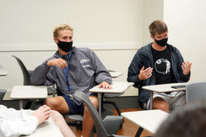 Freshmen Carter Berg (left) and Jack Collier share their thoughts during the Common Experience discussion group. Photo by Suzanne Carr Rossi.