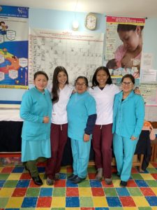 Lyka Ante '20 (second from right) and Erica Frey '20 (second from left) spent a semester in Peru, honing the skills they now use as postpartum nurses at INOVA Health System. "Working alongside Peruvian nurses and living with a host family helped me break down language barriers and build deeper connections with my patients and their families," Ante said. Photo courtesy of Lyka Ante.