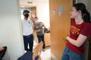 UMW President Troy Paino and wife Kelly check in on first-year student Madison Sams of Chesterfield, Virginia. Sams moved into Randolph Hall, one of several Mary Washington residence halls welcoming incoming freshmen during Move-In Day 2021. Photo by Suzanne Carr Rossi.