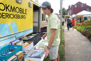 Hollis Cobb refurbished an old ambulance into a mobile library. Photo by Suzanne Carr Rossi.