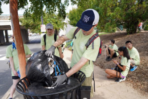 Kyle Close (foreground) leads a team picking up trash near the Fredericksburg train station. Photo by Suzanne Carr Rossi.