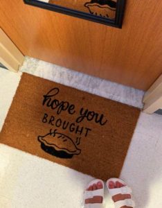 Maddison Pfautz shared a picture of this seasonal doormat at the entrance of a dorm room.