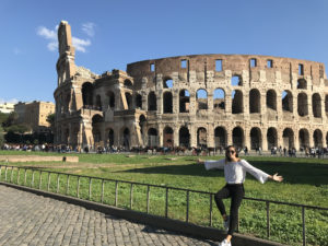 Repko poses in front of the Coliseum in Rome.