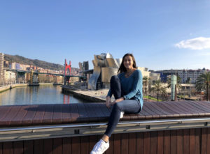 Sarah Repko '19 poses in front of the Guggenheim Museum on a bridge leading to Deusto, where she's on a fast track to earning a master's degree in Spain, thanks to one of UMW's new 4+1 international pathways.