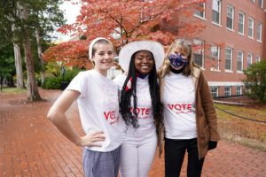 (From left to right) Junior philosophy major Ainsley Rucker and senior communication and digital studies and political science double-major Amber Brown pose with Center for Community Engagement Associate Director Sarah Dewees. The trio worked today with UMW Votes to help Mary Washington students who wanted to vote. Photo by Suzanne Carr Rossi.