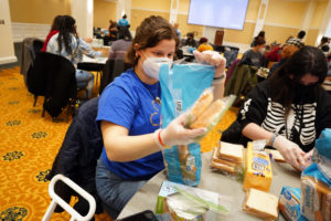 Emma Bradley (left) and Arden Jones make sandwiches for Fredericksburg's homeless community. Photo by Suzanne Carr Rossi.