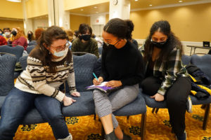 After their service projects, students broke out into teams to answer trivia about Martin Luther King Jr., James Farmer and other civil rights leaders. Photo by Suzanne Carr Rossi.