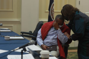 Interim Vice President for Alumni Relations and University Advancement Susan Worrell congratulates Rucker at this morning's meeting. Photo by Karen Pearlman.