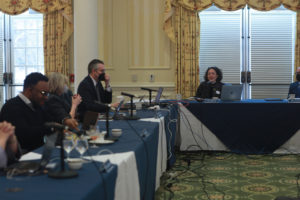 From left to right: BOV members Charles S. Reed Jr. '11 and Patricia Gwaltney McGinnis, Chief of Staff Jeff McClurken and BOV Rector Heather Mullins Crislip '95 during an emotional segment honoring Rucker at this morning's meeting. Photo by Karen Pearlman.