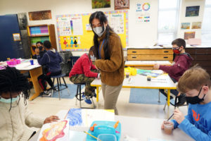 Chloe Wade observes fifth-graders in her art class at Falmouth Elementary. She knew she had a "knack for teaching" in high school, but it wasn't until she got into the classroom that she realized the profession was right for her. Photo by Suzanne Carr Rossi.