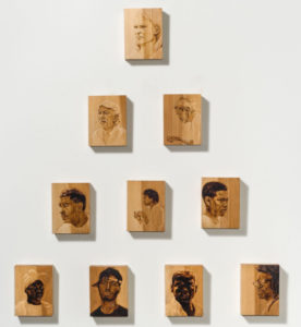 Natalie Erin Brown's series of woodburned portraits, "Value Pyramid," is on display in the UMW Galleries, on loan from the Petrucci Family Foundation.