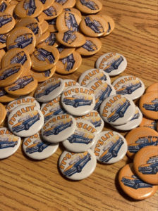 Bookmobile swag, such as these "It's Lit" buttons, can be found at events.