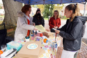 McDaid provides information to fellow students at the UMW Votes table on Election Day. Photo by Suzanne Carr Rossi.
