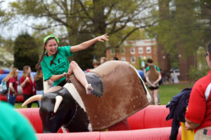 A Goat attempts to stay on the mechanical bull. Photo by Suzanne Carr Rossi.