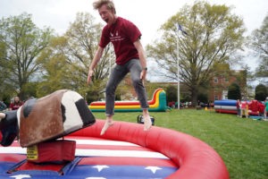 A Devil bounces in excitement after riding the mechanical bull. Photo by Suzanne Carr Rossi.