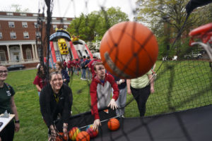 Aubrey Guerra, a Goat, and Parker Lee, a Devil, compete shooting hoops. Photo by Suzanne Carr Rossi.