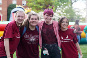 From left to right: Elizabeth Breckenridge, Emma Almassy, Rachel Nolan and Maddie Kimmitz show off their Devil pride. Photo by Suzanne Carr Rossi.