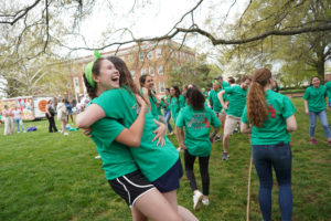 Two Goats hug after winning the tug-of-war. Photo by Suzanne Carr Rossi.