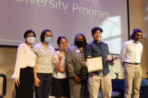 The organizers of Taste of Asia posed for a picture with James Farmer Multicultural Center Director Marion Sanford after winning the Outstanding Diversity Program Award. Photo by Kayla Zegada.