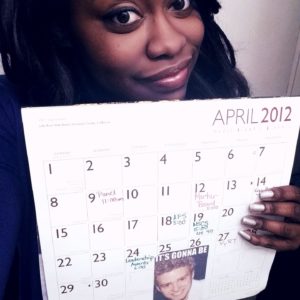 A decade ago, UMW alumna Kianna Davis '13 created the famous 'It's Gonna Be May' meme, which has since become a cultural phenomenon. Here, she shows off her April 2012 calendar from her junior year, which includes Mary Washington events such as Mortar Board and the Leadership Awards. Photo courtesy of Kianna Davis.