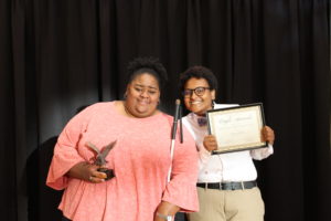Adrianna Giddings and Lu Sheikhnureldin pose for a photo after DiversAbility won the Outstanding Overall Achievement Award. Photo by Kayla Zegada.
