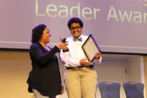 Senior Lu Sheikhnureldin, who emceed the event with Quinn Lipetz, received the Prince Woodard Outstanding Leader Award, presented by Associate Dean of Student Involvement Melissa Jones. Photo by Kayla Zegada.