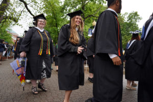 Despite the rain, joy was on the the graduates' faces as they processed onto Ball Circle on Saturday. Photo by Suzanne Carr Rossi. 