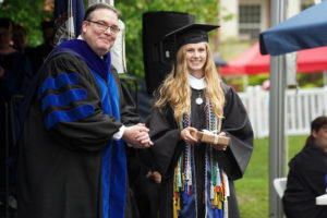 Interim Provost Tim O'Donnell and Sally Burkley pose for a photo after she received the Darden Award for earning the highest grade-point average for the Class of 2022. Photo by Suzanne Carr Rossi.