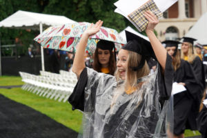 A newly minted UMW graduate cheers after the ceremony. Photo by Suzanne Carr Rossi. 