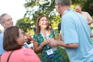 Mary Washington alumni, like Renee Kuntz '85 (center), reconnected with old friends and made new acquaintances at the first Reunion Weekend in three years. UMW welcomed back more than 1,200 graduates and their families to campus for the event. Photo by Karen Pearlman.