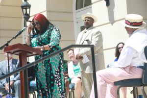 "He was such an awesome big brother," Diane Rucker said of Cedric, while brother Kim looks on. Many members of Rucker's family were present for Sunday's ceremony. Photo by Karen Pearlman.