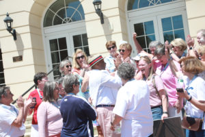 A sea of Rucker's classmates from the early '80s surrounds him in front of the soon-to-be Cedric Rucker University Center. Photo by Karen Pearlman.