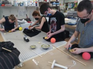Matthew Monaghan, Alex Anthes Rojas, Cameron Hovey and Ben Lechtman collaborate on a tabletop puppet production.