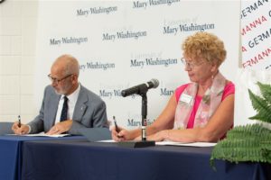 UMW President Troy Paino and Germanna President Janet Gullickson sign an agreement officially creating a pathway between the two schools to put students on a fast-track toward a business major. Photo by BC Photography.