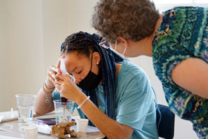 Shaniyah Lanier, a rising senior at Rappahannock High School, participates in 'Kitchen Chemistry: The Science Behind the Food We Eat' during UMW's Summer Enrichment Program, while Professor of Chemistry Kelli Slunt looks on. The weeklong residential program is designed to give high-schoolers a taste of college life. Photo by Suzanne Carr Rossi.