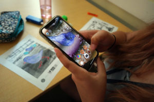 Wilson Memorial High School student Abby Ray Wilson uses an app to bring a colored picture to life. The activity was part of a lesson on augmented and virtual reality. Photo by Suzanne Carr Rossi.