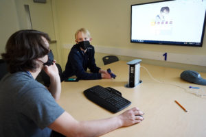 Justin Holden (left), a rising junior at Riverbend High School, and Calvin Rodriguez of Washington State participate in 'The Realities of Virtual Reality and Augmented Reality' course. Students used avatars to depict the ways in which they might represent themselves in varying environments. Photo by Suzanne Carr Rossi.