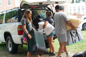 Ashley Firesheets of Alexandria gets some move-in help from parents Melanie and Scott Firesheets at Randolph Hall. Photo by Suzanne Carr Rossi.