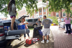 Entire families get into the act on move-in day, offloading, hauling and unpacking. Photo by Suzanne Carr Rossi.