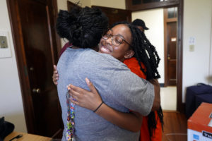 Jorja Furr hugs her mother after moving into her new room. Photo by Suzanne Carr Rossi.