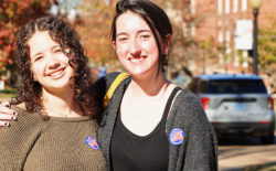 Students show their "I voted" stickers
