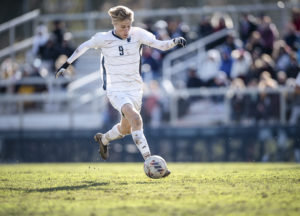 Carter Berg takes possession of the ball during the NCAA UMW men's soccer game against Ohio Wesleyan. Photo by Tom Rothenberg.