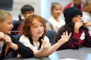 Battlefield Elementary School student Aidan Muller reacts to a chemistry experiment during a recent field trip to the University of Mary Washington. The experience, a collaboration between UMW and the Naval Surface Warfare Center Dahlgren Division, had students from 16 Spotsylvania schools crossing campus for lessons in STEM subjects. Photo by Suzanne Carr Rossi.