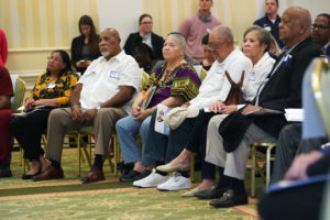 Robert Christian (second from left), who desegregated Fredericksburg's Maury School in 1962, sits with members of his family during the unveiling event. His story is told on the trail's Stop No. 7: Colored Cemetery at Potter's Field. It marks the site where bodies buried in a Black cemetery were interred to make room for the school. Photo by Suzanne Carr Rossi.