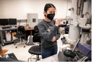 UMW student Boramy Meng works with the transmission electron microscope Irene Piscopo Rodgers gifted to Mary Washington in 2004. Having made a name for herself in the field of electron microscopy, Rodgers trained UMW faculty and students to use the instrument.