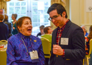 Rodgers chats in 2018 with Matt Tovar, who earned a bachelor's degree in biochemistry from Mary Washington in 2019 and received the Irene Piscopo Rodgers and James D. Rodgers Student Research Fellowship. He is now a project lead at The George Washington University Cancer Center.