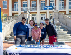 UMW students participated in a six-day event to recognize ASPIRE, an acronym that stands for Mary Washington's core values. The celebration, spearheaded by Long, debuted last year. Pictured here, from left to right: Long, former SGA President Joey Zeldin '23; Martina Pugh; Conner Rogers; and Carlos Nunes. Photo by Sam Cahill.