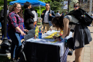 Jenny Wolfe encourages participation on Scholarship Day during last year's ASPIRE Week. Photo by Sam Cahill.